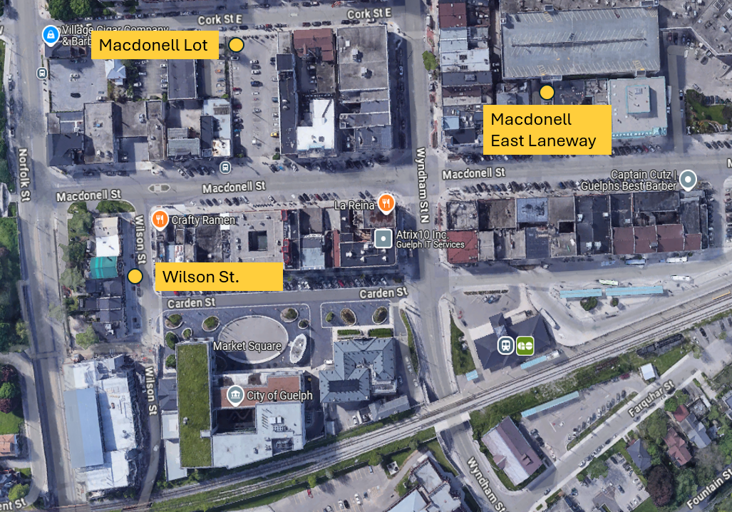 "Satellite view of downtown Guelph, Ontario, showing labeled streets including Macdonell St., Wilson St., Cork St E, Carden St, and Norfolk St.