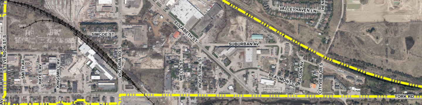 Aerial map of a suburban area with labeled streets, railway track, and highlighted major roads.