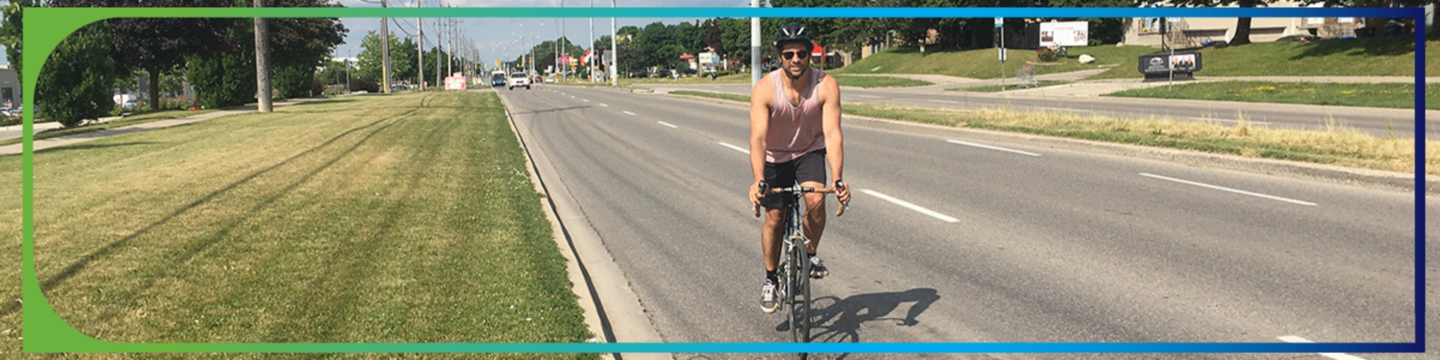 male cycling on road 