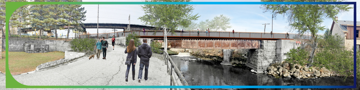 people walking towards bridge on paved path alongside the river