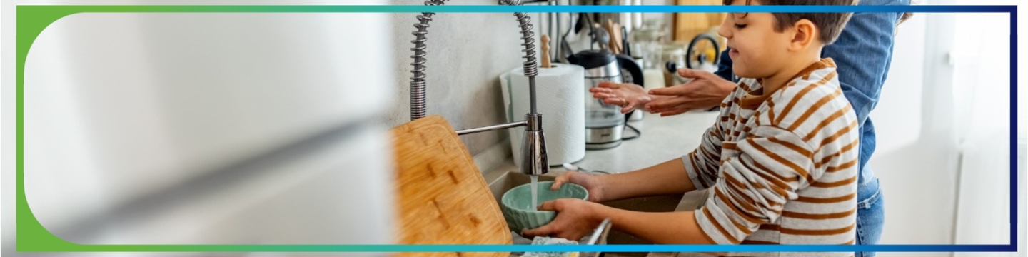 Boy washing his hands at the sink