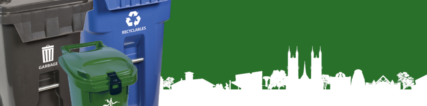 Three waste bins in front of a green background with a white cityscape silhouette. The black bin on the left is labeled 'GARBAGE' with a trash can icon, the blue bin in the middle is labeled 'RECYCLABLES' with a recycling symbol, and the green bin on the right has an icon suggesting organic waste but no visible label