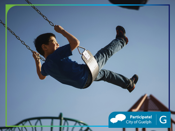 child swinging in the air on a swing at a park