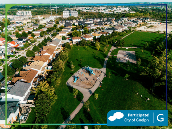 overhead image of a park area with a subdivision, condos and more new development in the background